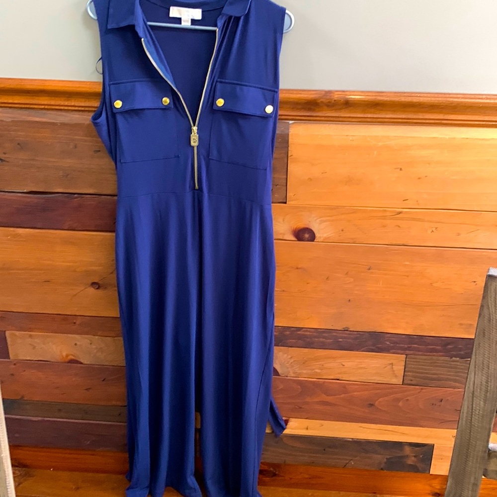 Dark blue jump suit, ties in the back.